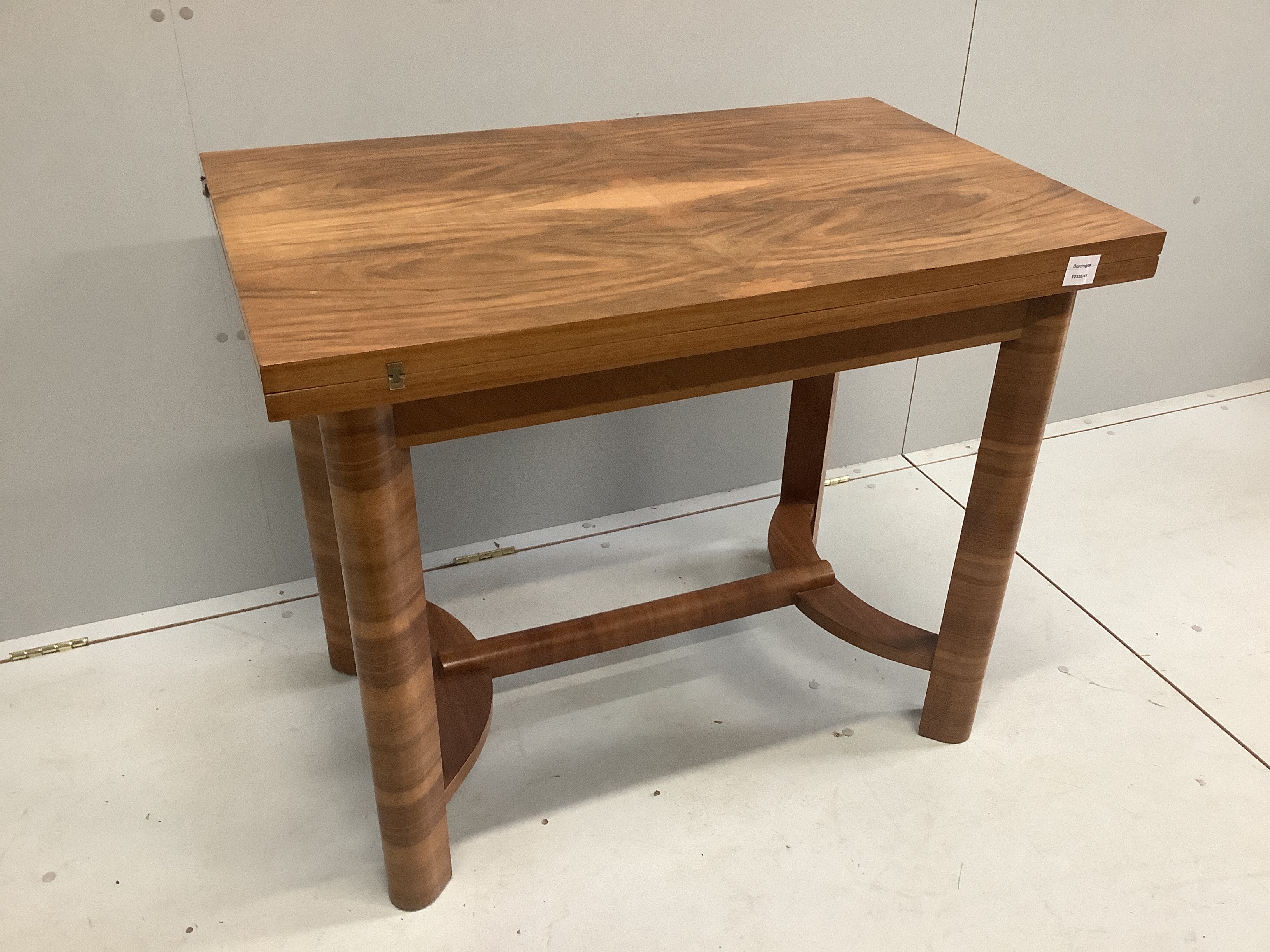 An Art Deco style rectangular walnut folding table, width 92cm, depth 59cm, height 76cm